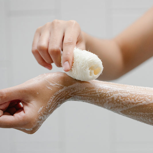 Image of a person applying soap and foam is seen on his arm