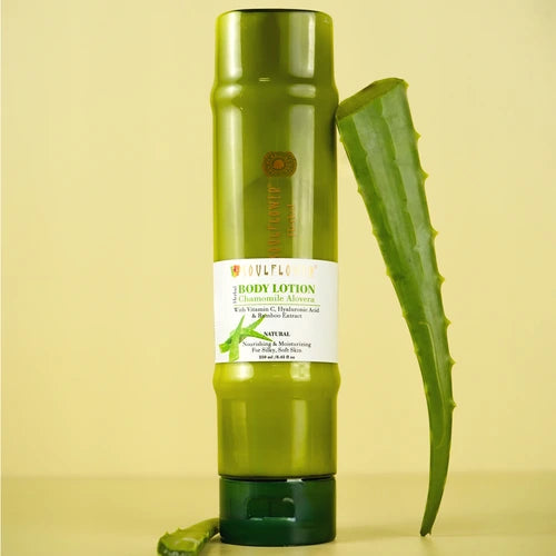 Soulflower Aloe Vera Bamboo Hyaluronic Acid Body Lotion bottle standing beside a fresh aloe vera leaf on a yellow background.