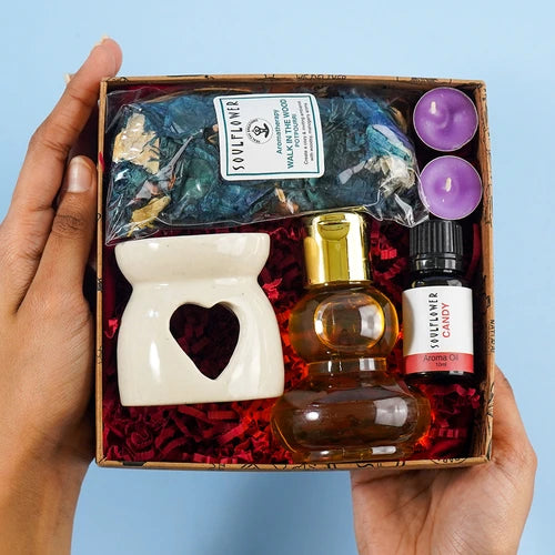 Soulflower Delight Gift Box featuring Ceramic Diffuser, Candy Aroma Oil, T-Light Candles, and Essential Oils, perfect for relaxation.