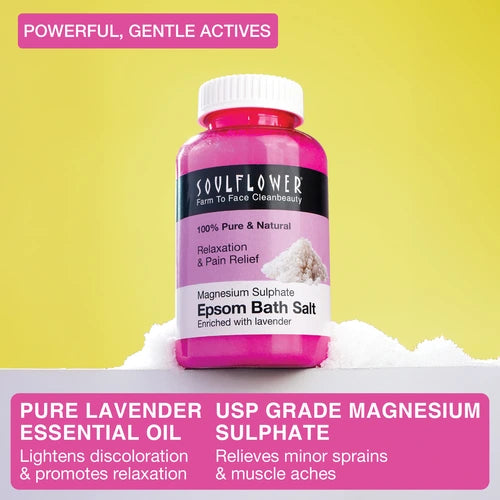 Soulflower Epsom Bath Salt bottle placed on white salt with text highlighting powerful actives—pure lavender essential oil for relaxation and USP grade magnesium sulphate for relief from sprains and muscle aches.
