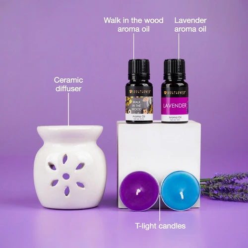 Experience the Soulflower Lavender & Walk In The Wood Ceramic Diffuser Set, which includes a beautifully handcrafted ceramic diffuser, two exquisite essential oil bottles, and candle tabs, all designed to create a peaceful and rich atmosphere.