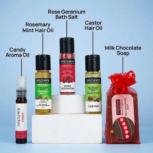 Soulflower Surprise Gift Box with hair oils, bath salt, aroma oil, and chocolate soap.