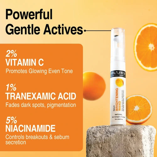 Soulflower Vitamin C Brightening Serum with powerful actives: 2% Vitamin C for even tone, 1% Tranexamic Acid for fading dark spots, and 5% Niacinamide for controlling breakouts, with orange fruit in the background.