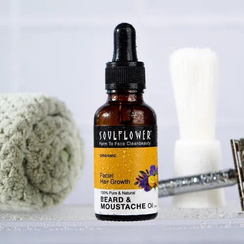 Soulflower Beard & Moustache Oil bottle featuring a premium blend of lemon, geranium, olive, and orange extracts for healthy beard growth.